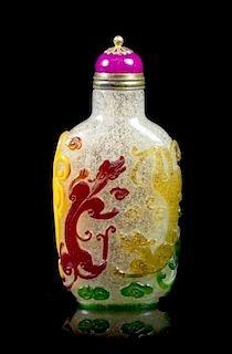 A Peking Glass Five-Color Overlay Snuff Bottle, Height 2 3/4 inches.