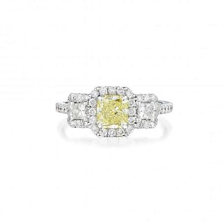 An 18K White Gold, Yellow Diamond and Diamond Ring