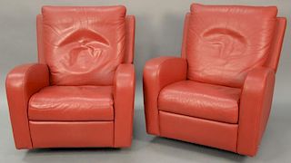 Pair of Natuzzi red leather reclining swivel club chairs.