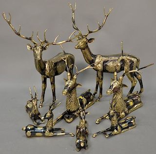 Eight piece Continental brass deer grouping. largest: ht. 23 1/4in., lg. 18in., smallest: ht. 8in., lg. 11 1/4in.