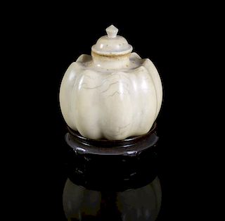 A Carved Ivory Snuff Bottle, Height overall 2 1/2 inches.