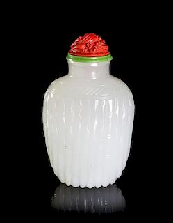 A White Glass Simulating Jade Snuff Bottle, Height 2 1/4 inches.