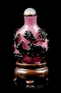 A Black and Pink Glass Overlay Snuff Bottle, Height 1 5/8 inches.