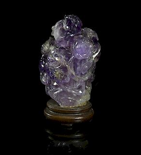 A Carved Amethyst Quartz Snuff Bottle, Height overall 3 1/4 inches.
