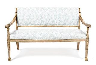 An Italian Walnut and Parcel Gilt Settee, Height 34 1/4 x width 54 1/4 x depth 19 3/4 inches.