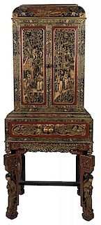 A Large and Ornately Carved Chinese Cabinet on Stand.