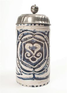 A Molded Earthenware and Pewter Stein, Height 10 inches.