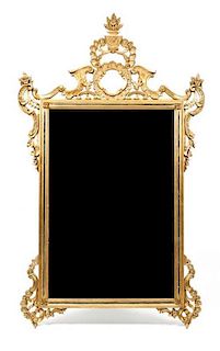 An Italian Rococo Style Giltwood Mirror, Height 60 x width 36 inches.