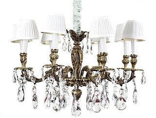 A Louis XV Style Bronze and Crystal Eight-Light Chandelier, Diameter 31 inches.