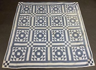 Blue and White Pieced Quilt