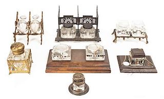 A Group of Seven Glass Inkwells on Stands, Length of longest 10 inches.