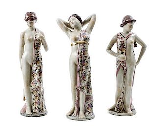 A Set of Three Pottery Figures of Female Bathers, Height 14 inches.