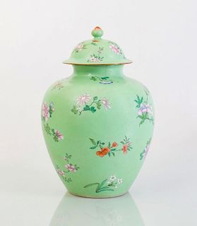 CHINESE APPLE GREEN SGRAFFITO-GROUND FAMILLE ROSE PORCELAIN JAR AND COVER