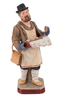A PORCELAIN FIGURE OF A BULOCHNIK (PASTRY-SELLER), GARDNER PORCELAIN MANUFACTORY, MOSCOW, LATE 19TH CENTURY