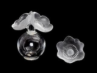 * A Lalique Molded and Frosted Glass Perfume Bottle Height of first 6 1/4 inches.