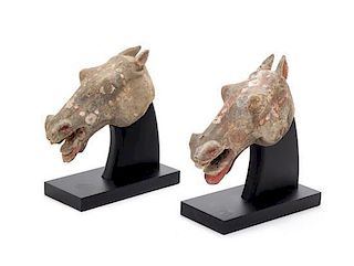 * Two Painted Pottery Heads of Horses Length of each 7 inches.