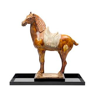 * A Straw Glazed Pottery Figure of a Horse Height 21 1/4 inches.