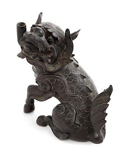A Bronze Qilin- Form Candle Holder Length 7 inches.