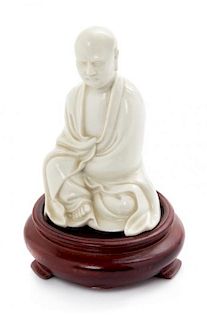 * A Blanc-de-Chine Porcelain Figure of a Luohan Height 4 inches.