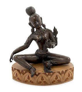 An Indian Bronze Figure of a Deity Height 10 inches.