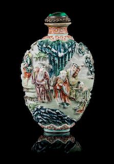 A Molded Famille Rose Porcelain Snuff Bottle Height 3 inches.