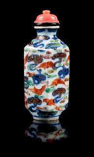 An Underglaze Blue and Enamelled Porcelain Snuff Bottle Height 2 7/8 inches.