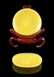 * Two Yellow Peking Glass Snuff Saucers Diameter of larger 1 3/8 inches.