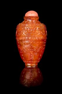 * A Carved Canelian Snuff Bottle Height 2 1/2 inches.
