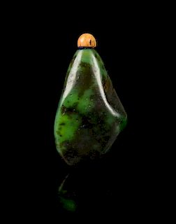 * A Spinach Jade Pebble-Form Snuff Bottle Height 2 1/2 inches.