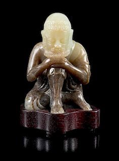 A Black and White Jade Figure of a Luohan Height 3 1/2 inches.
