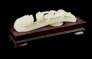 * A Carved White Jade Belt Hook Length 3 3/4 inches.