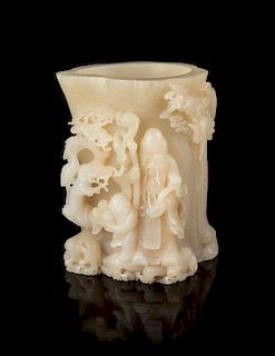 * A Carved White Jade Brushpot Height 7 1/4 inches.