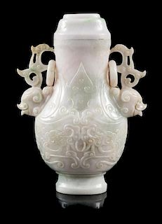 A Jadeite Covered Vase Height 6 1/4 inches.
