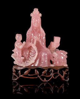 * A Carved Rose Quartz Figure of Guanyin Height 8 1/2 inches.