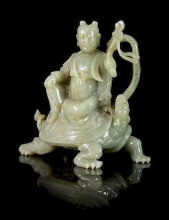 * A Carved Hardstone Figural Group of an Immortal and a Tortoise Height 8 inches.