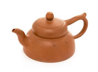 A Yixing Pottery Teapot Height 3 1/4 inches.
