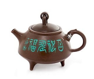 A Yixing Pottery Teapot Height 3 1/2 inches.