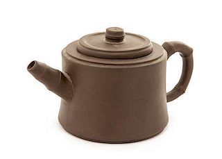 A Yixing Pottery Teapot Height 3 1/2 inches.