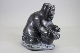 Carved Sculpture of Inuit Hunter Capturing Seal
