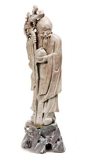 A Hardstone Carving of a Scholar, Height 17 1/2 inches.