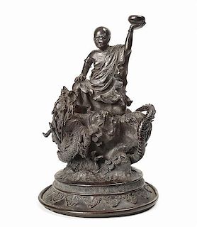 A Japanese Bronze Figure of a Luohan and Dragon, Height 10 3/8 inches.