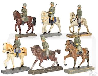 Six German painted composition soldiers