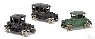 Three Arcade cast iron model T Ford cars