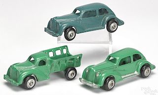 Three small Arcade cast iron cars