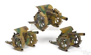 Three German camouflage painted tin field guns