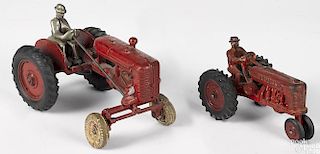 Two cast iron farm tractors