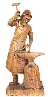 POSSIBLY GERMAN CARVED WOODEN "BLACKSMITH"