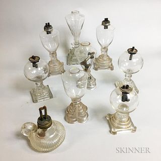 Nine Colorless Glass Oil Lamps