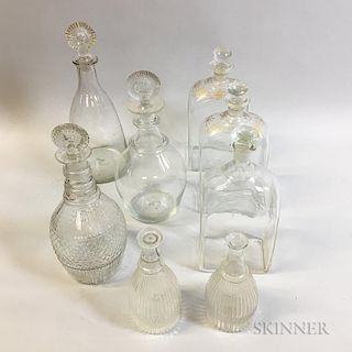 Eight Colorless Blown Glass Decanters