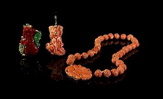 Three Carved Coral Pendants, Height of first 2 inches, average diameter of each bead 12 millimeters.